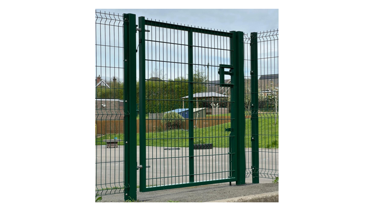 Green metal pedestrian gates at a school