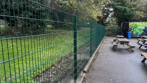 Green security mesh fencing at a school