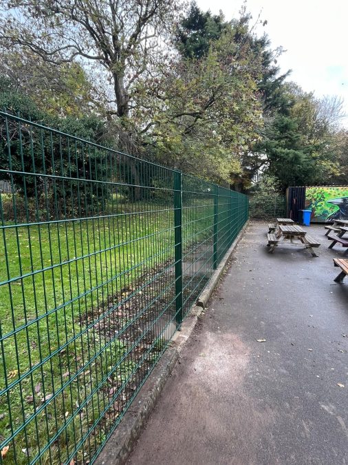 Green security mesh fencing at a school