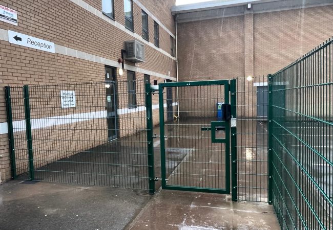 A pedestrian gate and mesh fending at Meadow Lane School