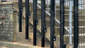 Black security mesh at the side of steps at Bilton School