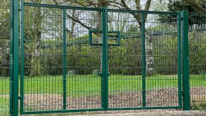 Green steel mesh pair or vehicle access gates