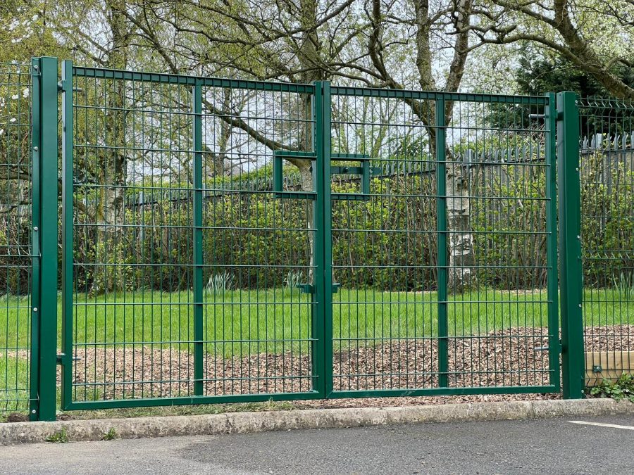 Green steel mesh pair or vehicle access gates
