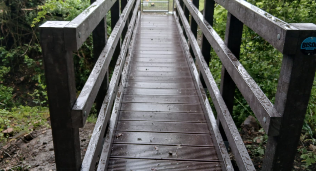 A long-life recycled plastic deck on a Bison pedestrian bridge