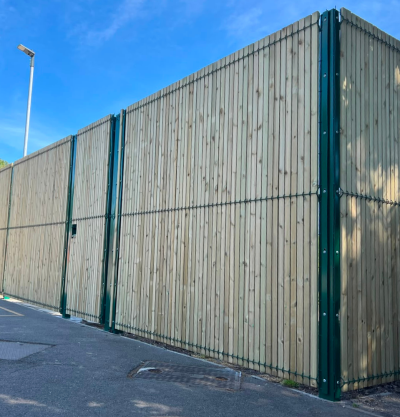 Green security mesh fence panel with timber slats in to form to provide privacy