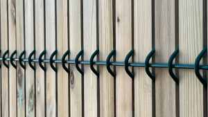Timber slats in green security mesh
