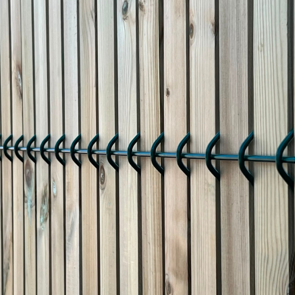 Timber slats in green security mesh
