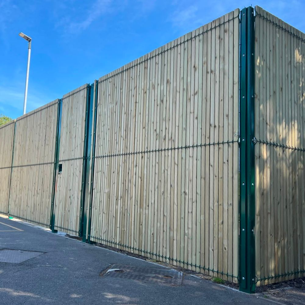 Green security mesh fence panel with timber slats in to form to provide privacy
