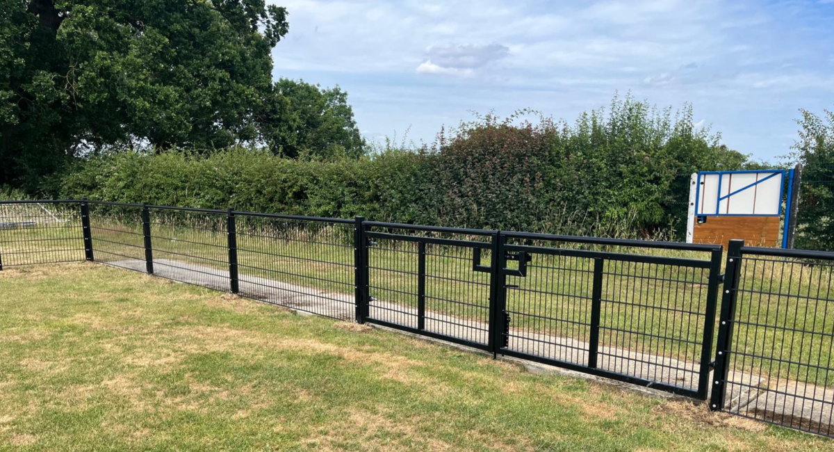 Black Spectator double gates at a football club - suitable for vehicle access