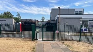 Bowtop steel fencing with a pedestrian gate access to Pegasus School