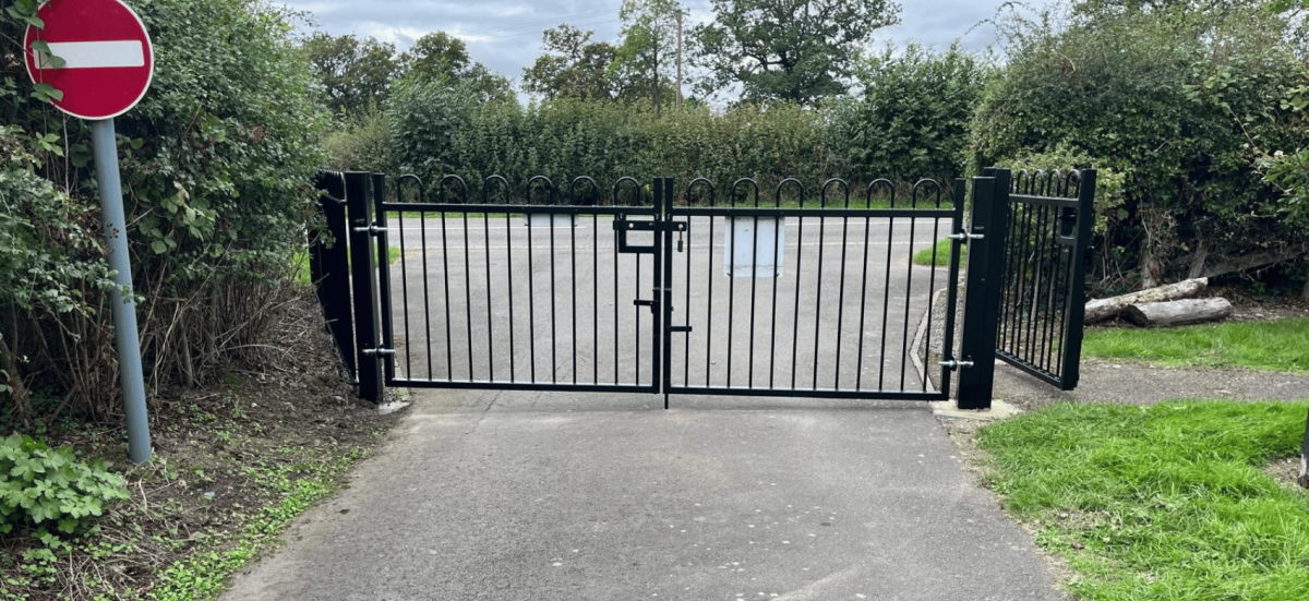 Black steel vehicle entrance gates